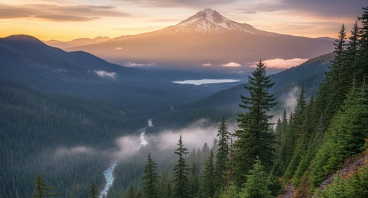 Scenic view of Oregon's mountainous landscape showcasing peaks, forests, and a serene lake at sunset. Perfect for hiking.