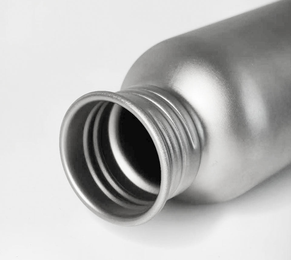 Close-up of Titanium Travel Bottle on a white background