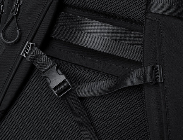 Adjustable strap detail on back panel of black outdoor backpack