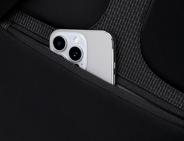 Hidden back pocket for smartphone on waterproof backpack