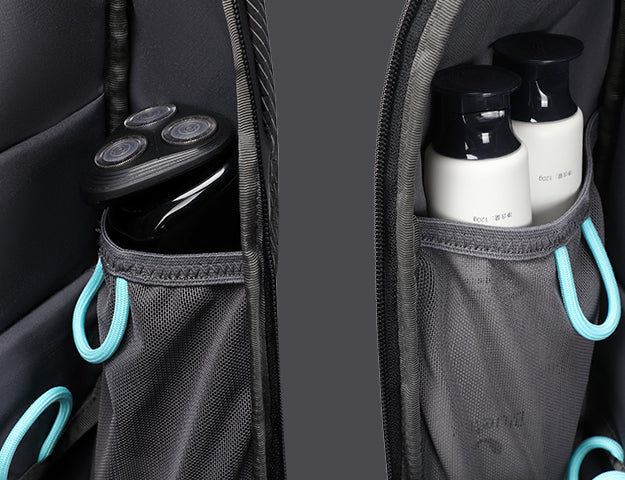 Dual bottle pockets in everyday carry backpack with blue elastic loops